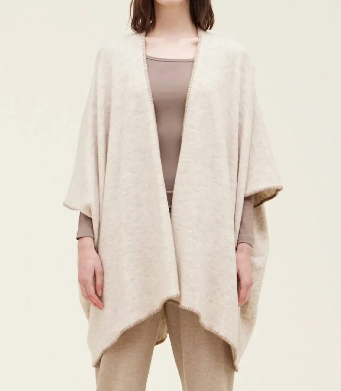 Short Sleeve Women's Cashmere Sweater Dresses in Pastel HuesWhipstitch Poncho Cardigan In Natural Short Sleeve Women's Cashmere Sweater Dresses in Pastel HuesWhipstitch Poncho Cardigan In Natural
