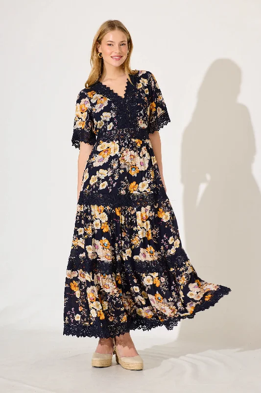 Maxi dresses with ruffled tiers for a romantic beach weddingMona Maxi Dress In Ink With Rust Floral Maxi dresses with ruffled tiers for a romantic beach weddingMona Maxi Dress In Ink With Rust Floral