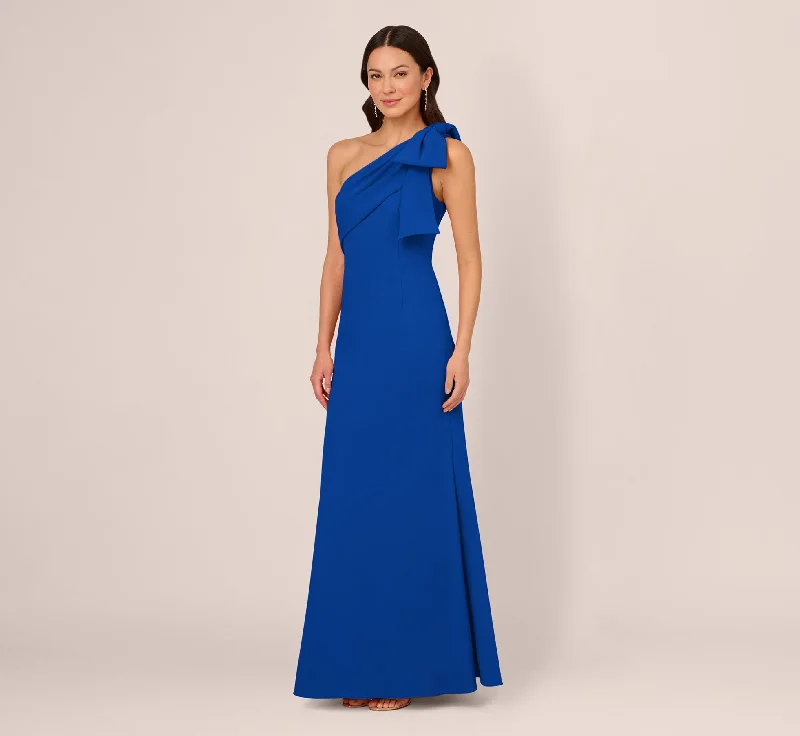 Maxi dresses with ruffled sleeves and bow accents for a sweet and charming lookStretch Crepe One Shoulder Mermaid Gown With Bow Accent In Violet Cobalt Maxi dresses with ruffled sleeves and bow accents for a sweet and charming lookStretch Crepe One Shoulder Mermaid Gown With Bow Accent In Violet Cobalt