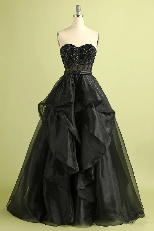 Cocktail dresses with a tiered skirt and a bow at the waistBlack Strapless Ball Gown Evening Dress Cocktail dresses with a tiered skirt and a bow at the waistBlack Strapless Ball Gown Evening Dress